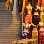 A vendor sells traditional Bedouin sequined costumes